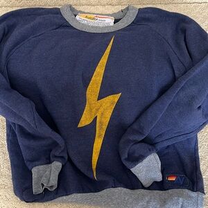 Aviator Nation Women’s S blue sweatshirt with yellow lightning bolt.